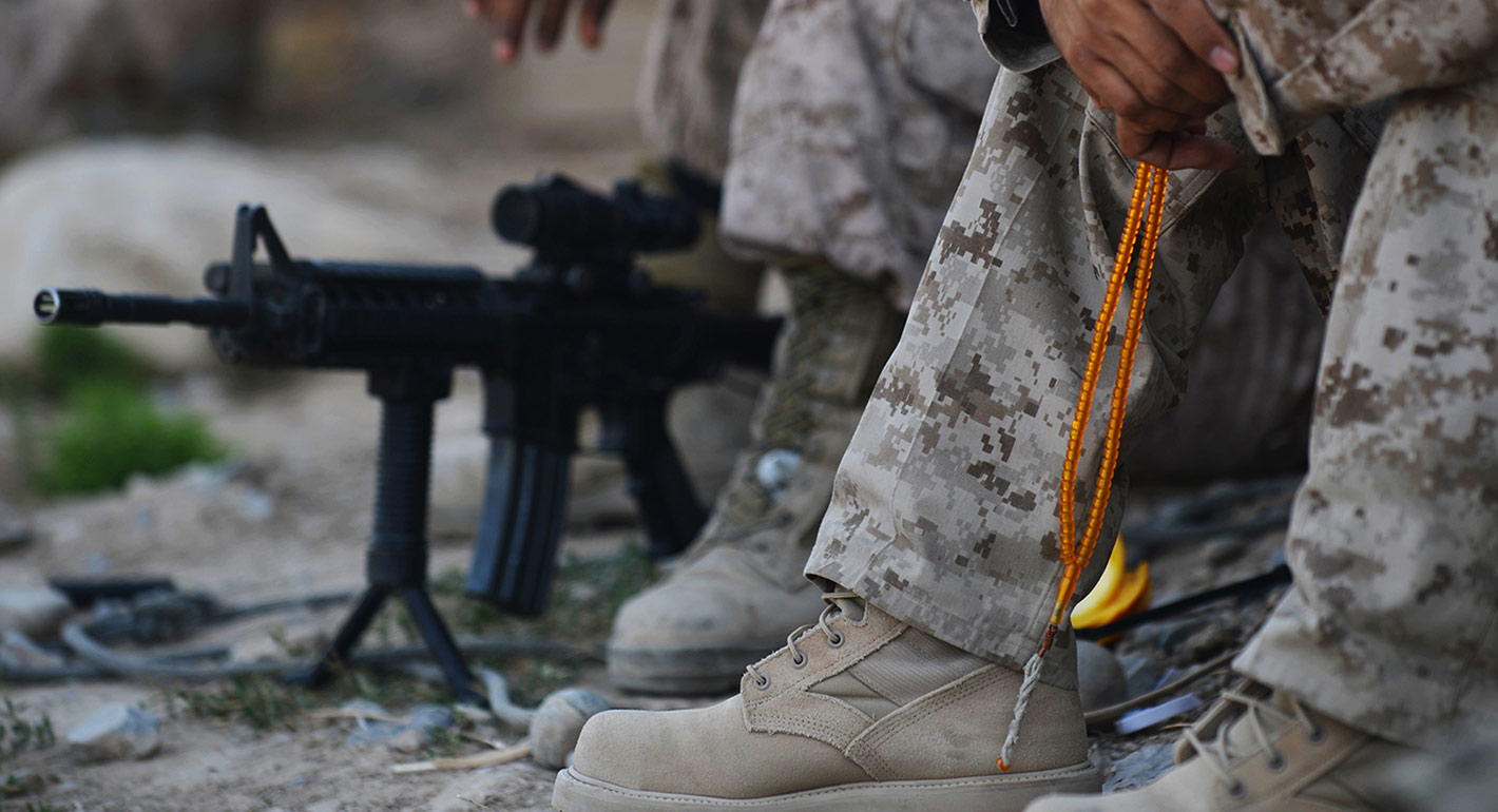 A 'tarjamah' or interpreter for US Marines from 1st Battalion 7th Marines Regiment holds his prayer 